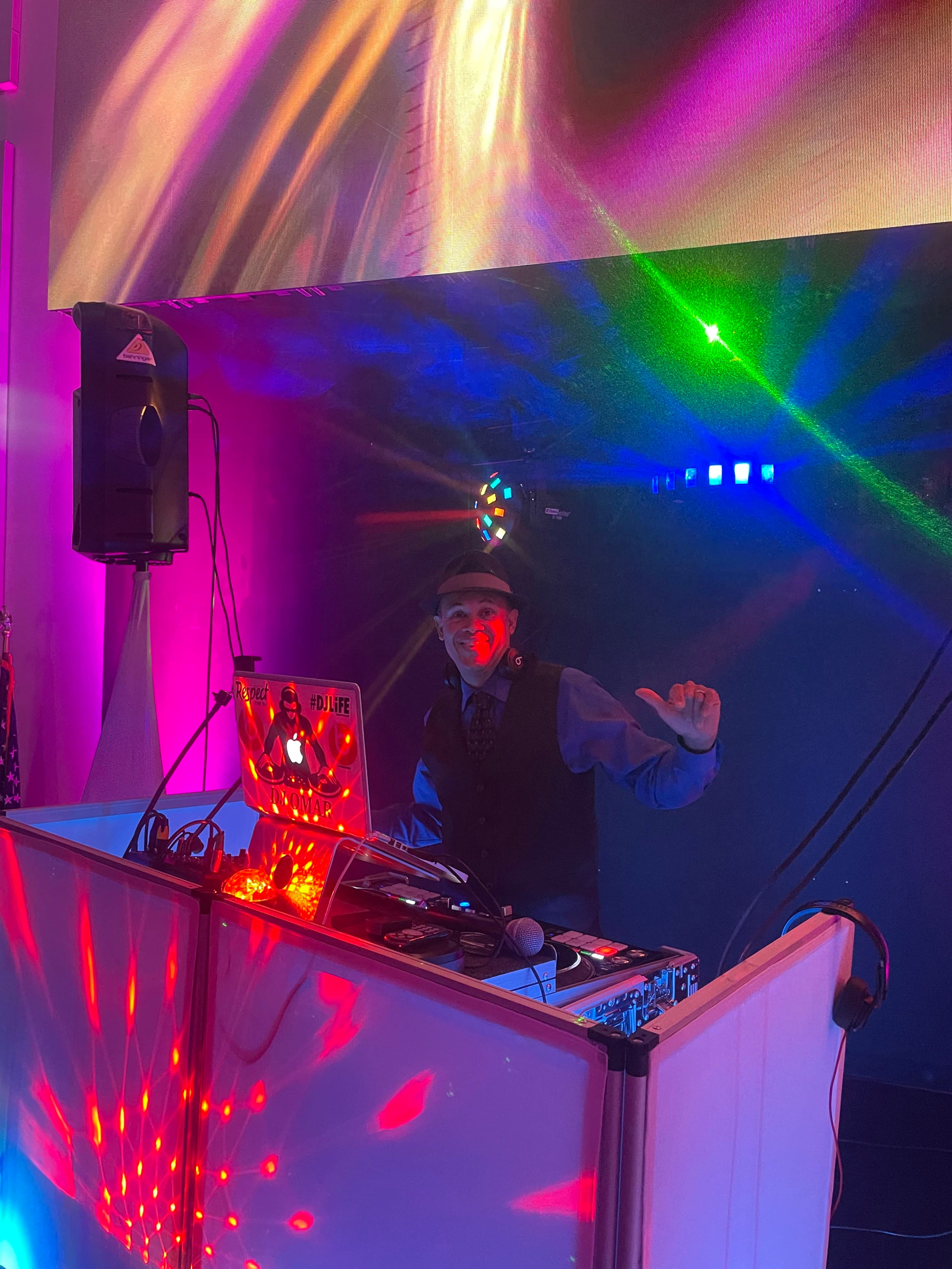 DJ Omar performing for a packed venue